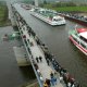 A boat carrying aqueduct over a river.